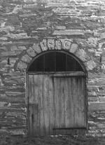 SA0741.23 - Photo of round barn, detail of north doorway showing date stones.